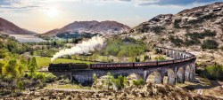 Fotobehang viaduct in Schotland met de Jacobite stoomtrein_AS110968730